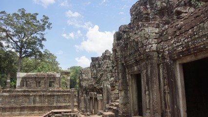Naklejka premium There are over 200 faces of Bayon , a temple in Angkor Thom and each of them is unique in its own way as they stare at you from every corner