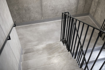Modern elegant minimalist concrete staircase with black steel railings, Escape concrete stairs - 226454144