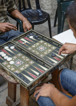Men playing backgammon at the old city, Acre (Akko), Israel.