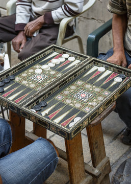 Men playing backgammon at the old city, Acre (Akko), Israel.