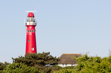 Fototapeta na wymiar Old lighthouse on the dutch isle Schiermonnikoog