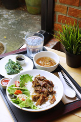 Simple lunch set with streamed pork with spring roll and soup. 