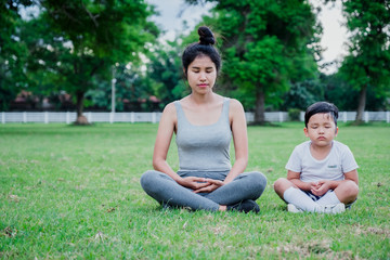  Mother and child meditation in park