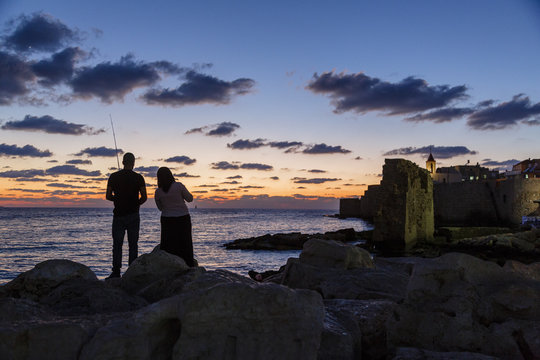 Fisherman staring by the port in the old city, Acre (Akko), Israel.