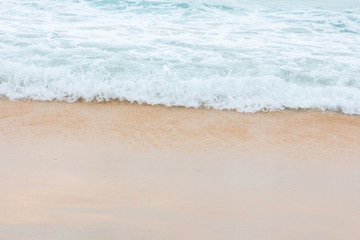 Wave of the sea on the sand beach.