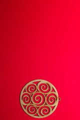 Christmas wooden toy ball on a red background