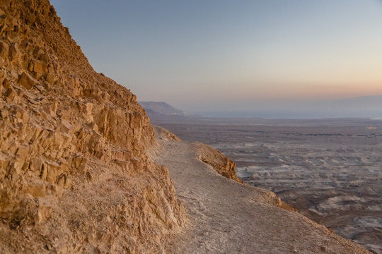 The snake path at sunrise leading up to Masada fortress at the edge of the Judean Desert, Israel.