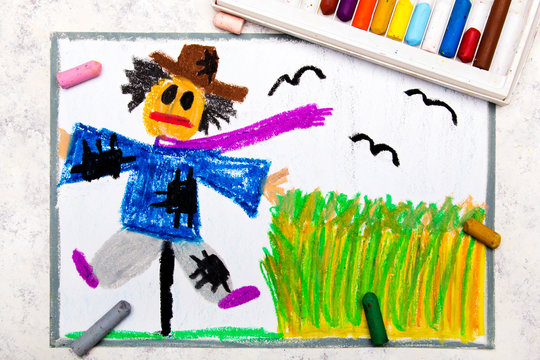 Colorful hand drawing: scary scarecrow next to the grain field