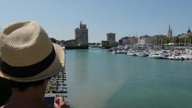 woman photograph the port of La Rochelle, France