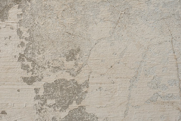 Fototapeta premium Wall fragment with scratches and cracks. It can be used as a background