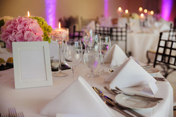 Elegant candlelight dinner table setting at reception