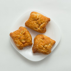 Freshly baked butter croissant white background, top view