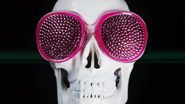 skull wearing sparkling sunglasses