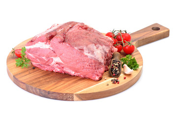 Pork meat with spices and vegetables on white background