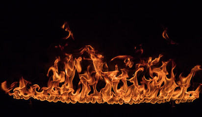 Texture of fire on a black background. - obrazy, fototapety, plakaty