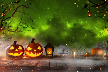 Halloween pumpkins on old wooden planks.
