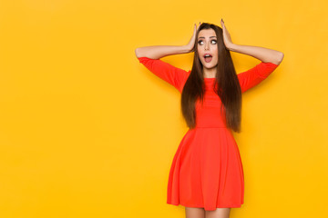 Worried Woman Holding Head In Hands And Looking Away