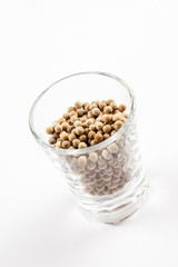 White pepper seeds in a glass Isolated On White Background, ingredient