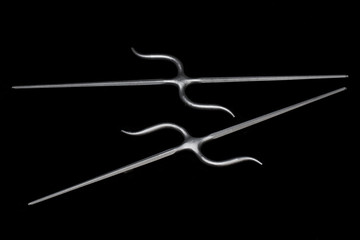 Nunti Sai (wrought iron) in black background