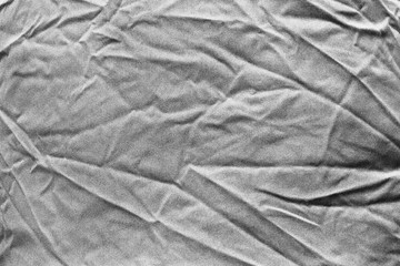 Wrinkled grey cloth closeup, may be used as background or texture