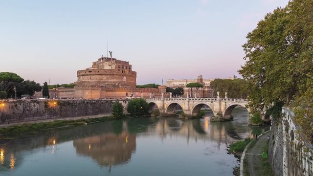 Day to night time lapse video of Castel Sant'Angelo and bridge over Tiber river in Rome, Italy

