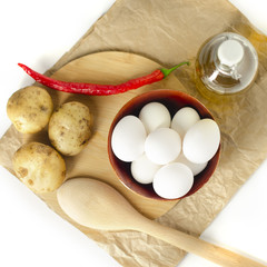 vegetables, eggs, potatoes, red pepper on a white background