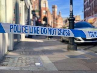  Police line do not cross crime scene perimeter cordon tape in a London street