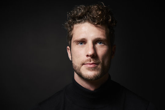 Stubble guy in studio, portrait
