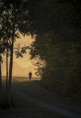 Obraz na płótnie Canvas Man running silhouette at sunrise