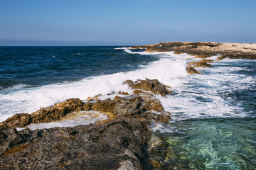 Fototapeta na wymiar Rocky mediterranean shoreline of Malta