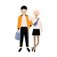 Obraz premium Hipster boy and girl dressed in trendy clothes standing together. Modern boyfriend and girlfriend. Cartoon characters isolated on white background. Colorful vector illustration in flat style.