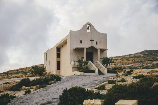 Old church on a rocky hill in Gozo, Malta