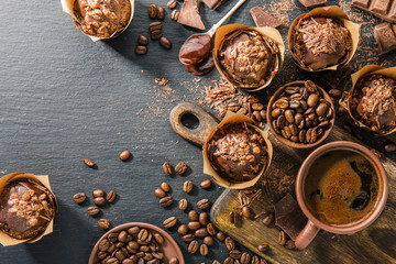 Chcolate muffins on dark table