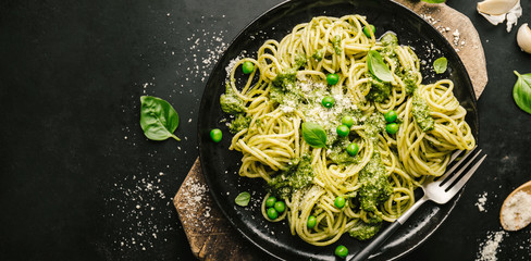 Tasty pasta with pesto served on plate