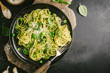 Tasty pasta with pesto served on plate
