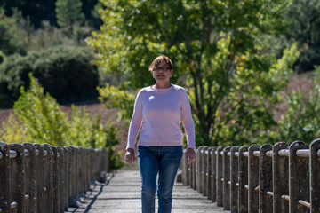 Fototapeta premium Woman on bridge