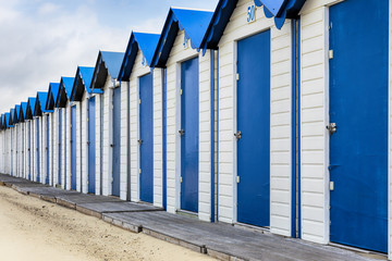 Naklejka premium Row of beach cabins in France