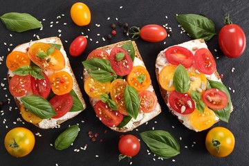 Sandwiches with cheese and tomatoes.