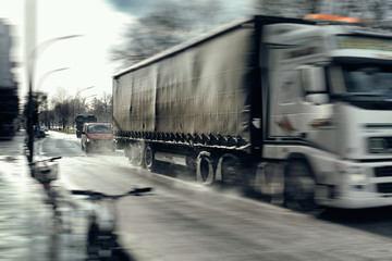 Obraz na płótnie Canvas Truck fast driving on the street danger accident