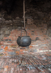 The old and ancient cauldron in a farmhouse