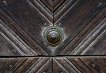 The old and vintage wooden door of a farmhouse