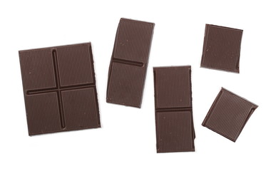 Dark chocolate with cocoa bars, pieces isolated on white background, top view