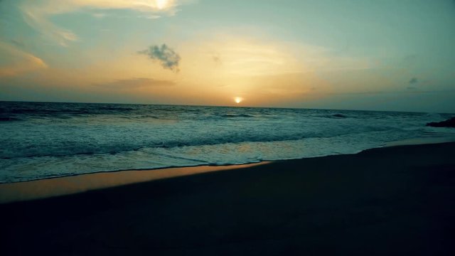sea surf at sunset