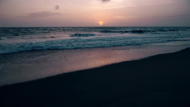 sea surf at sunset