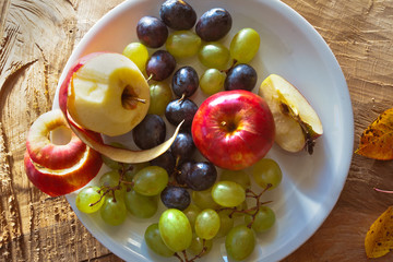 Breakfast fresh fruit. Apples and grapes.