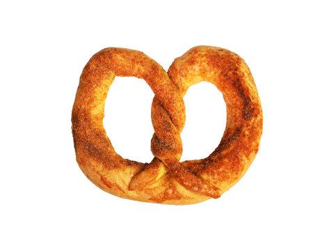 Homemade pretzel with cinnamon and sugar isolated on white background. A pretzel or breze is a baked bread product made from dough shaped into a twisted knot. Pretzels originated in Early Middle Ages 