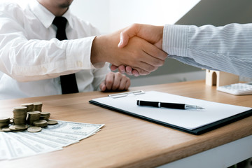 Business people signing contract making a deal with real estate agent Concept for consultant and home insurance concept.