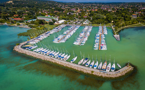 Balatonkenese, Hungary - Aerial panoramic view of Kenese Marina Port with lots of yachts and sailboats in the morning