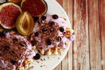 breakfast with waffles plums figs berries