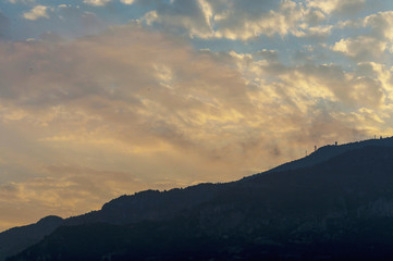 Fototapeta premium Stunning cloudy pink and white sky over Monaco at sunset in summer